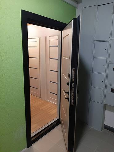 Дверь в квартиру с отделкой МДФ