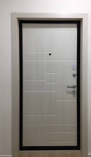 Фото квартирной двери с МДФ